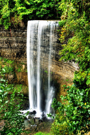 Beautiful waterfall on small forest river in the Ontario regionの写真素材