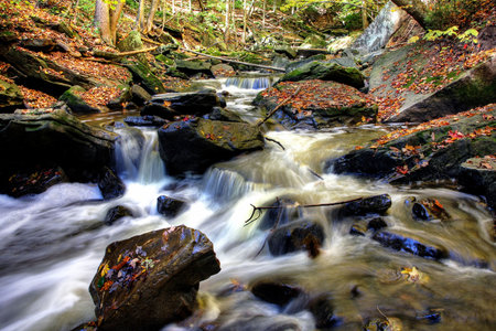 Beautiful waterfall on small forest river in the Ontario region