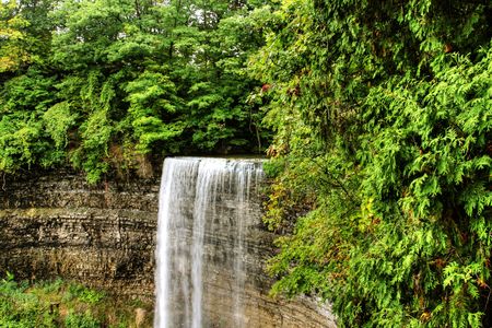 Beautiful waterfall on small forest river in the Ontario regionの写真素材
