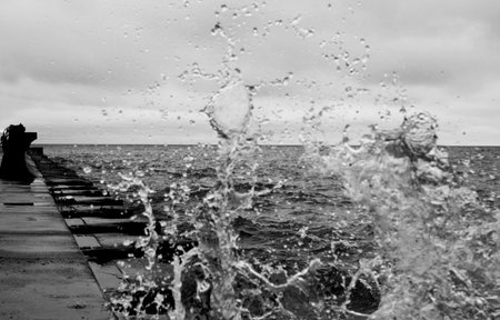 A fishing pier during a rainy, stormy dayの写真素材