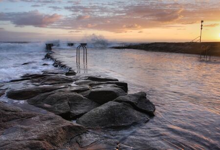 Natural ocean swimming pool at Yamba beachの写真素材