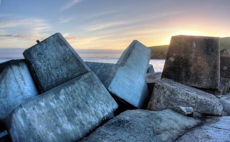 Breakwater, ocean wall for protection of the harbourの写真素材