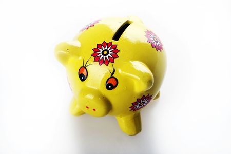 Yellow Piggy Bank against white backgroundの写真素材