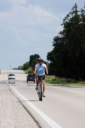 women rider crossing a bridge in Canadaの写真素材