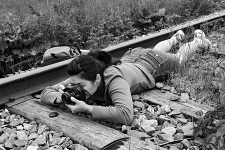 The girl photographer in summer parkの写真素材