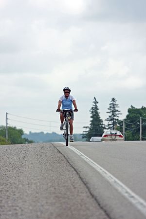 women rider crossing a bridge in Canadaの写真素材