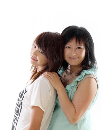 mum and daughter having fun, isolated on white backgroundの写真素材