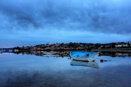 boat lying on the side at low tideの写真素材