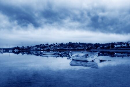 boat lying on the side at low tideの写真素材