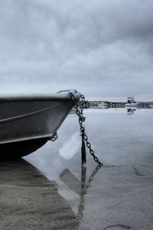 boat lying on the side at low tideの写真素材