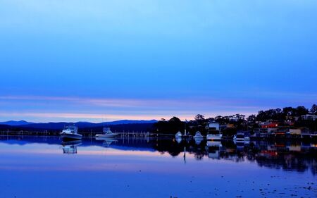 boat lying on the side at low tideの写真素材