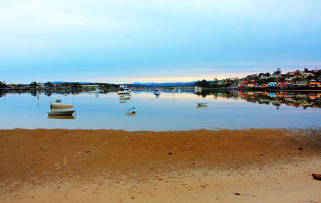 boat lying on the side at low tideの写真素材