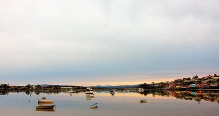 boat lying on the side at low tideの写真素材