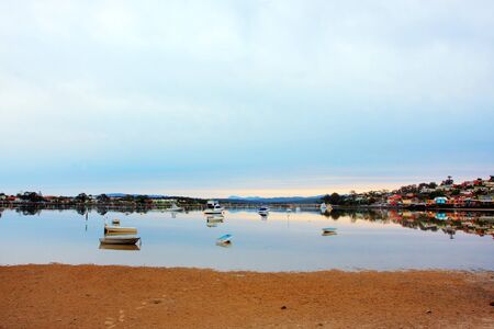 boat lying on the side at low tideの写真素材