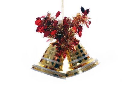 golden christmas bell against white backgroundの写真素材