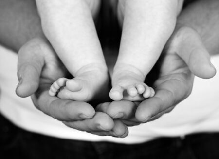 father holding daughter in tender embraceの写真素材