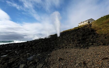 the little blowhole in action in kiamaの写真素材