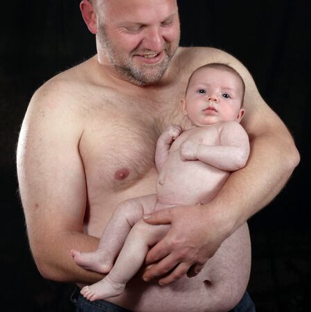 loving portrait of a father and newborn daughterの写真素材