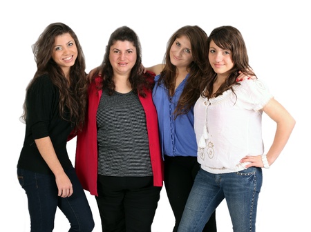 three happy sisters against white backgroundの写真素材