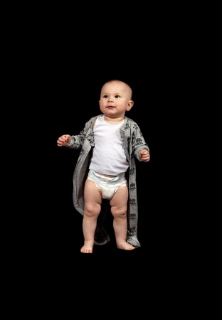 first steps of young toddler in a nappyの写真素材