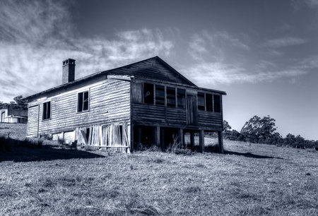 rustic wooden cottage on a sunny dayの写真素材