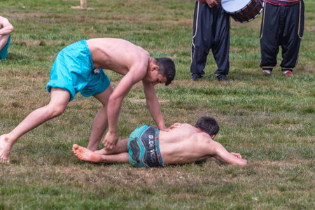 Unidentified shalwar(shalvar) gurescileri (kuroshio/wrestlers). Shalwar wrestling is a kind of traditional Turkish wrestling which is popular in Turkey. ISTANBUL,TURKEY,May 13,2017のeditorial素材