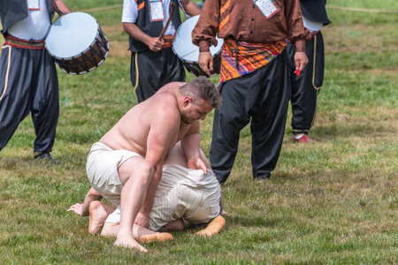 Unidentified shalwar(shalvar) gurescileri (kuroshio/wrestlers). Shalwar wrestling is a kind of traditional Turkish wrestling which is popular in Turkey. ISTANBUL,TURKEY,May 13,2017のeditorial素材