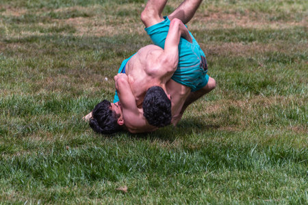 Unidentified shalwar(shalvar) gurescileri (kuroshio/wrestlers). Shalwar wrestling is a kind of traditional Turkish wrestling which is popular in Turkey. ISTANBUL,TURKEY,May 13,2017のeditorial素材