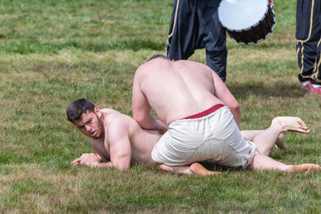 Unidentified shalwar(shalvar) gurescileri (kuroshio/wrestlers). Shalwar wrestling is a kind of traditional Turkish wrestling which is popular in Turkey. ISTANBUL,TURKEY,May 13,2017のeditorial素材