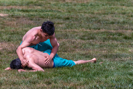 Unidentified shalwar(shalvar) gurescileri (kuroshio/wrestlers). Shalwar wrestling is a kind of traditional Turkish wrestling which is popular in Turkey. ISTANBUL,TURKEY,May 13,2017のeditorial素材
