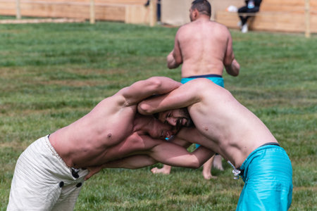 Unidentified shalwar(shalvar) gurescileri (kuroshio/wrestlers). Shalwar wrestling is a kind of traditional Turkish wrestling which is popular in Turkey. ISTANBUL,TURKEY,May 13,2017のeditorial素材