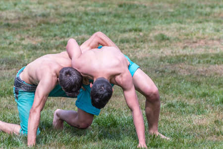 Unidentified shalwar(shalvar) gurescileri (kuroshio/wrestlers). Shalwar wrestling is a kind of traditional Turkish wrestling which is popular in Turkey. ISTANBUL,TURKEY,May 13,2017のeditorial素材