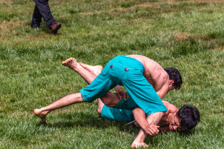 Unidentified shalwar(shalvar) gurescileri (kuroshio/wrestlers). Shalwar wrestling is a kind of traditional Turkish wrestling which is popular in Turkey. ISTANBUL,TURKEY,May 13,2017のeditorial素材