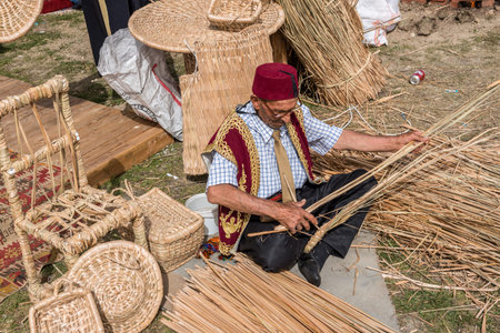 Unidentified man makes a traditional wicker basket. ISTANBUL, TURKEY,MAY 13,2017