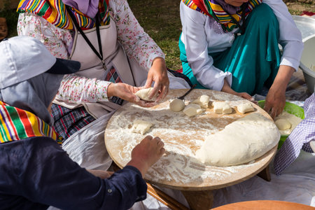 Preparation of a traditional Turkish yufka for pastries - gozleme by hands of a women. ISTANBUL,TURKEY - May 13, 2017のeditorial素材