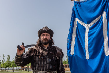 Unidentified man with a sword in costume of ancient Turkish troops of ottoman empire soldiers.ISTANBUL,TURKEY,MAY 13,2017のeditorial素材