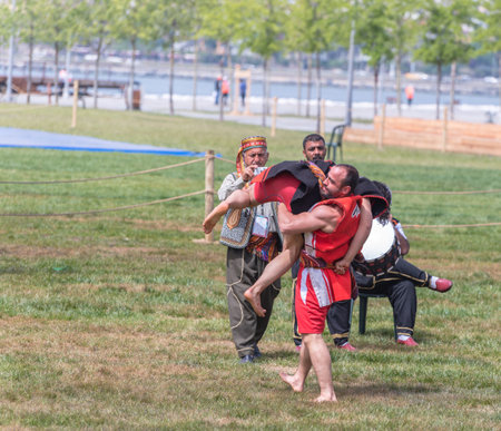 Unidentified people perform aba guresi (kuroshio/wrestlers)at a public event.Aba wrestling is a traditional Turkish wrestling also called Asirtmali Aba Wrestling. ISTANBUL,TURKEY,May 13,2017のeditorial素材