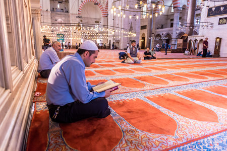 ISTANBUL,TURKEY - June 6,2017:Turkish muslim men praying in  suleymaniye mosque in Istanbul,Turkey.Suleymaniye mosque,. Tourists and local people visit this historical landmark every season.のeditorial素材