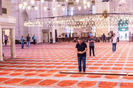 ISTANBUL,TURKEY - June 6,2017:Turkish muslim men praying in  suleymaniye mosque in Istanbul,Turkey.Suleymaniye mosque,. Tourists and local people visit this historical landmark every season.のeditorial素材