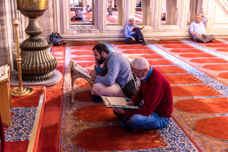 ISTANBUL,TURKEY - June 6,2017:Turkish muslim men praying in  suleymaniye mosque in Istanbul,Turkey.Suleymaniye mosque,. Tourists and local people visit this historical landmark every season.のeditorial素材