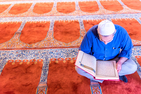 ISTANBUL,TURKEY - June 6,2017:Turkish muslim men praying in  suleymaniye mosque in Istanbul,Turkey.Suleymaniye mosque,. Tourists and local people visit this historical landmark every season.のeditorial素材