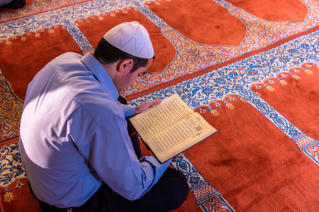 ISTANBUL,TURKEY - June 6,2017:Turkish muslim men praying in  suleymaniye mosque in Istanbul,Turkey.Suleymaniye mosque,. Tourists and local people visit this historical landmark every season.のeditorial素材