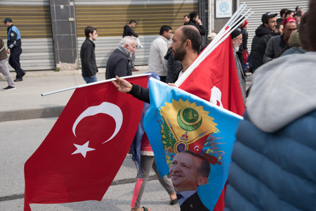 TURKEY, ISTANBUL, APRIL 8, 2017:AKP (Justice and Development Party) supporters shout slogans and wave party flags during a yes referendum /plebiscite campaign rally in Istanbul, Yenikapi meeting area.のeditorial素材