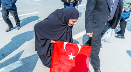 TURKEY, ISTANBUL, APRIL 8, 2017:AKP (Justice and Development Party) supporters shout slogans and wave party flags during a yes referendum /plebiscite campaign rally in Istanbul, Yenikapi meeting area.のeditorial素材