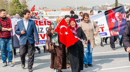 TURKEY, ISTANBUL, APRIL 8, 2017:AKP (Justice and Development Party) supporters shout slogans and wave party flags during a yes referendum /plebiscite campaign rally in Istanbul, Yenikapi meeting area.のeditorial素材