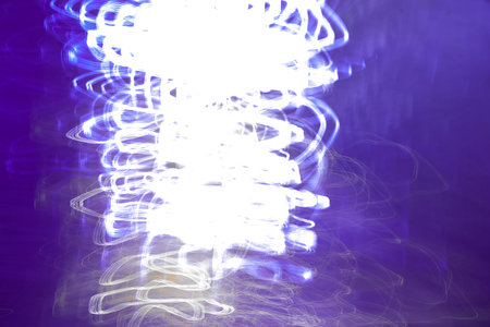 Multicolor abstract soft light painting of background of light trails with circular rotation in a...