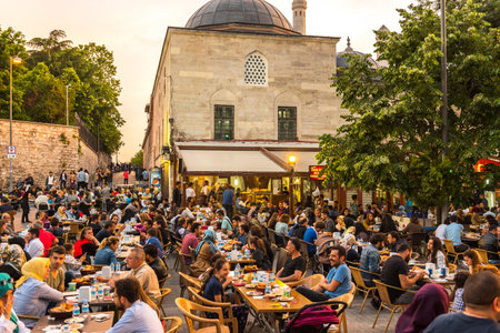 ISTANBUL, TURKEY - JUNE 4, 2017: People are eating iftar(evening meal,dinner) during Ramadan in Suleymaniye square. Suleymaniye district is the most popular place for Ramadan activities in Istanbulのeditorial素材