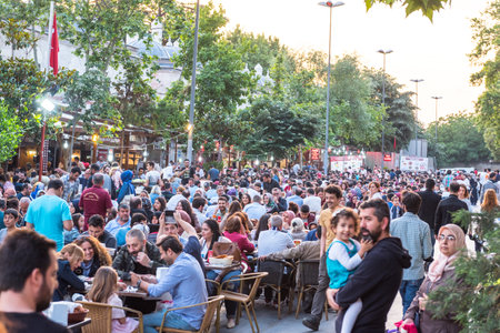 ISTANBUL, TURKEY - JUNE 4, 2017: People are eating iftar(evening meal,dinner) during Ramadan in Suleymaniye square. Suleymaniye district is the most popular place for Ramadan activities in Istanbulのeditorial素材