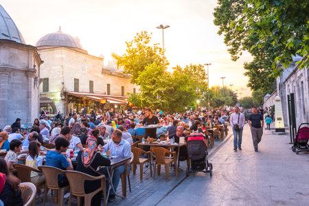 ISTANBUL, TURKEY - JUNE 4, 2017: People are eating iftar(evening meal,dinner) during Ramadan in Suleymaniye square. Suleymaniye district is the most popular place for Ramadan activities in Istanbulのeditorial素材