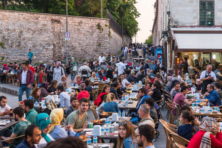 ISTANBUL, TURKEY - JUNE 4, 2017: People are eating iftar(evening meal,dinner) during Ramadan in Suleymaniye square. Suleymaniye district is the most popular place for Ramadan activities in Istanbulのeditorial素材